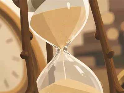 Reloj de arena y reloj sobre el escritorio